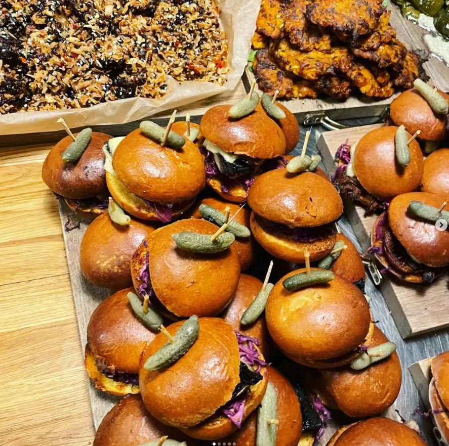 Platters of sliders and sharing food laid out for a private event