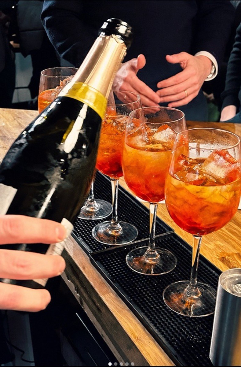 Prosecco poured into spritz cocktails at the bar