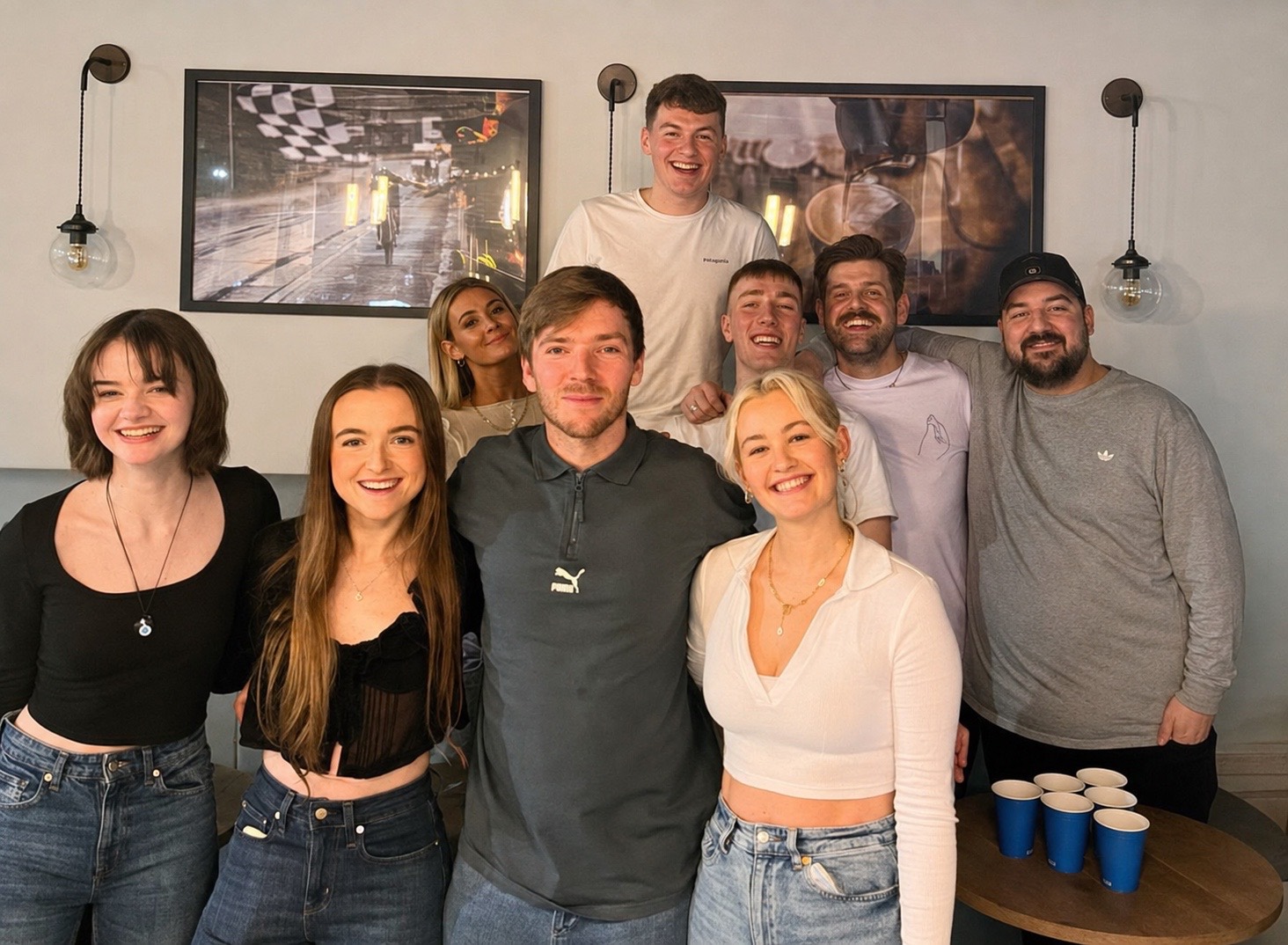 The Clubhouse team smiling together in the cafe